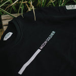 Close-up of Moon Soldier black sweatshirt with minimalist vertical linear logo design.