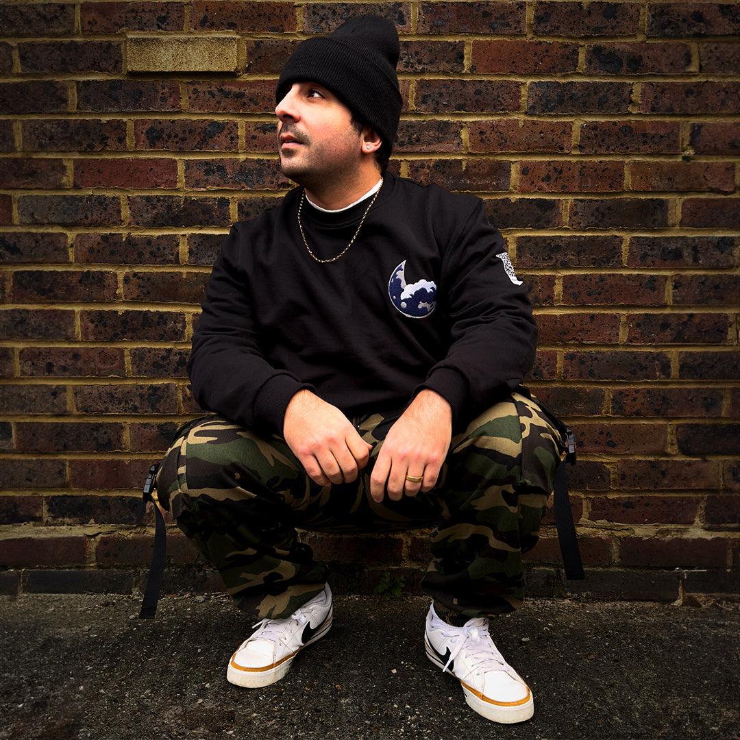 Blue Moon black sweatshirt by Moon Soldier with embroidered moon crest, cloud design, and cozy, soft-touch fabric.